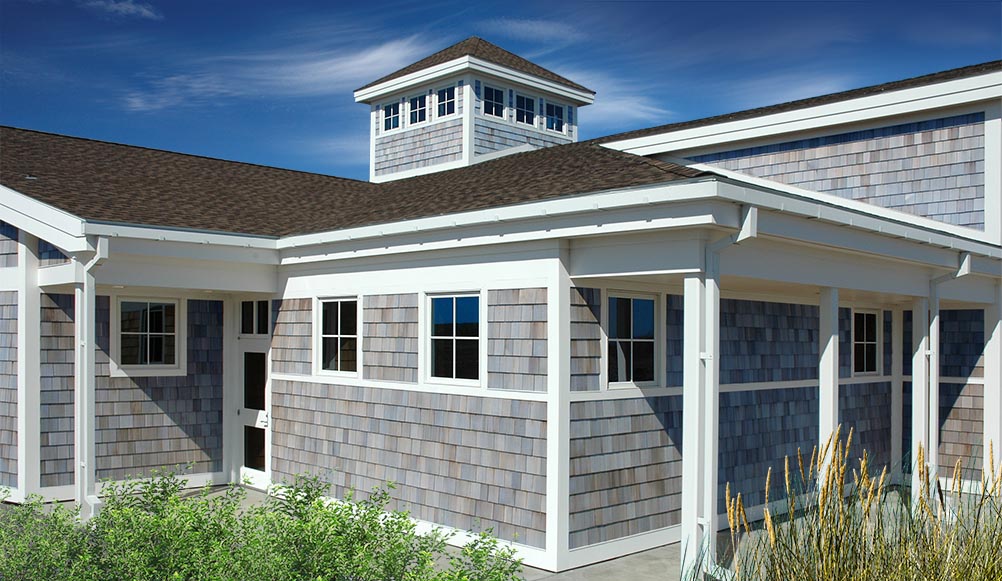 Nature center building with weathered gray western red cedar shingle siding.