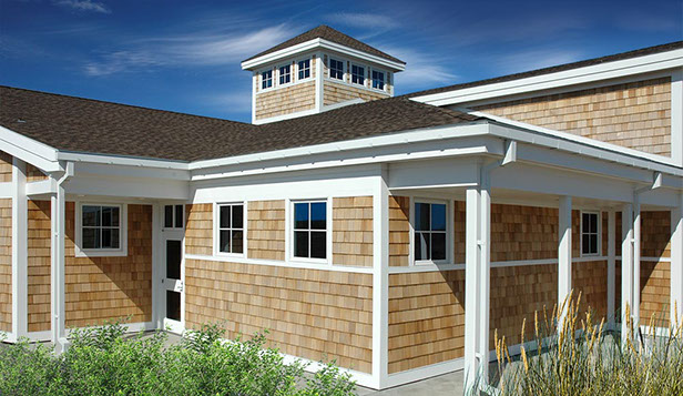 Nature center building with unfinished western red cedar shingle siding.